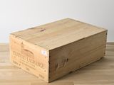 a wooden box that is sitting on a wooden floor