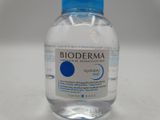 a bottle of water sitting on a table with a label on it
