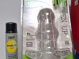 a bottle of glue next to a package of plugs