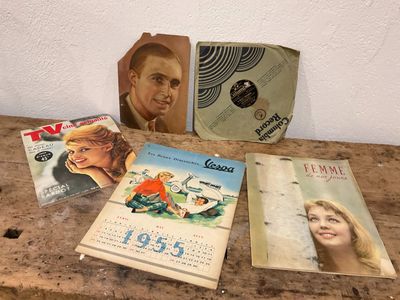 a lot of books on a table with pictures on them