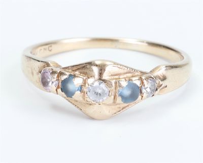 a close up of a gold ring with blue and white stones