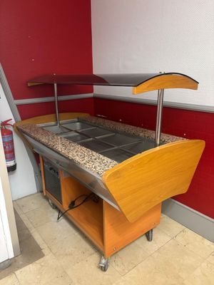 an image of a kitchen with granite counter tops and red walls