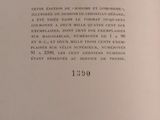 an open book with a black and white image of a clock on it