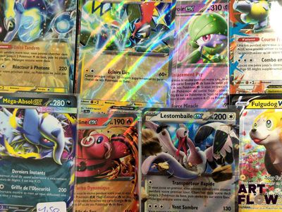 a lot of pokemon cards that are on the table