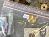a bag of coins sitting on a table next to a bag of coins