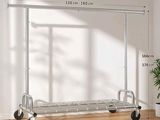 a metal rack with wheels and a plant in a room