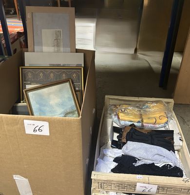 two boxes with clothes and pictures on them in a room