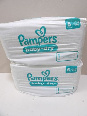 two packs of pampers baby dry diapers stacked on top of each other