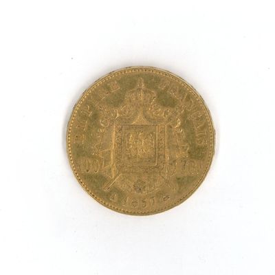 an old gold coin with a coat of arms on it