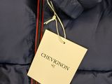 a close up of a blue jacket with a tag on it