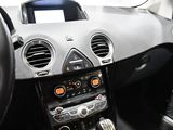 the interior of a car with a steering control and dashboard controls
