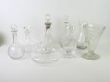 a lot of glass vases on a white table