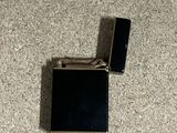 two lighters on the floor next to each other