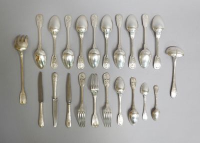 a lot of spoons and forks on the table
