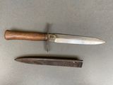 three different types of knives on a table with a knife in the middle
