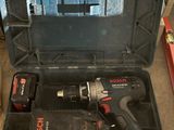 a tool box with tools inside of it on the floor