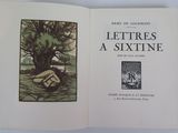 an open book with a picture of a tree in the middle of it