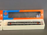 two train cars that are sitting in a box