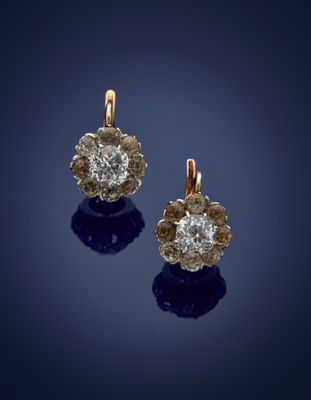 a pair of diamond and gold earrings