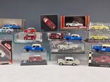 many different models of cars in a display case
