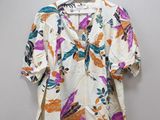 an image of a shirt hanging on a hanger on a wall