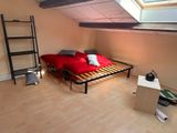 an image of a bedroom with a bed and a ladder