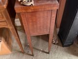 a small table with a lamp on top of it
