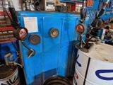 an image of a blue machine in a garage