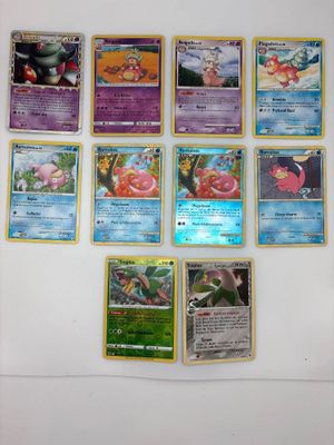 beaucoup de cartes pokemon sur le mur