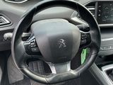 the interior of a car with a steering wheel and dashboard controls