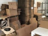 a room with a lot of boxes and boxes on the floor