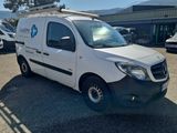 a white van that is parked in a parking lot