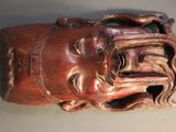 an image of a sculpture of a head on a table