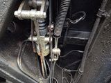 a close up of a motorcycle engine with a chain attached to it
