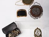 three pieces of jewelry sitting on top of a table next to each other