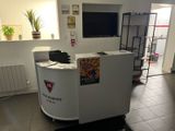 a white counter with a tv on it in a room