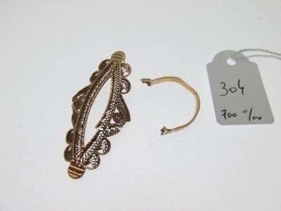 a close up of a gold ring with a price tag on it