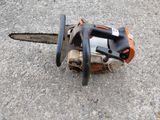 a chainsaw sitting on the ground on the ground