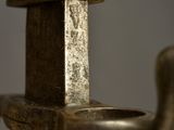 a close up view of a sword with a metal handle