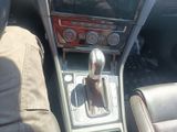 a picture of a car dashboard with a gear shift
