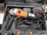 a tool in a case with a cord and a drill