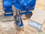 a blue box with a silver faucet and a blue box with a silver faucet on it