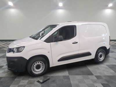 a picture of a white van parked on a checkered floor