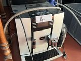 a coffee machine that is sitting on the floor