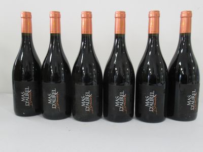 six bottles of wine lined up in a row on a table
