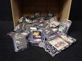 a cardboard box filled with assorted items on a black surface