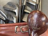 a bag of golf clubs and a bag of golf clubs