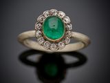 an emerald and diamond cluster ring