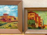 two paintings of buildings and a bridge are on display in a museum