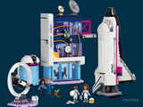a lego space station with a space shuttle and astronauts